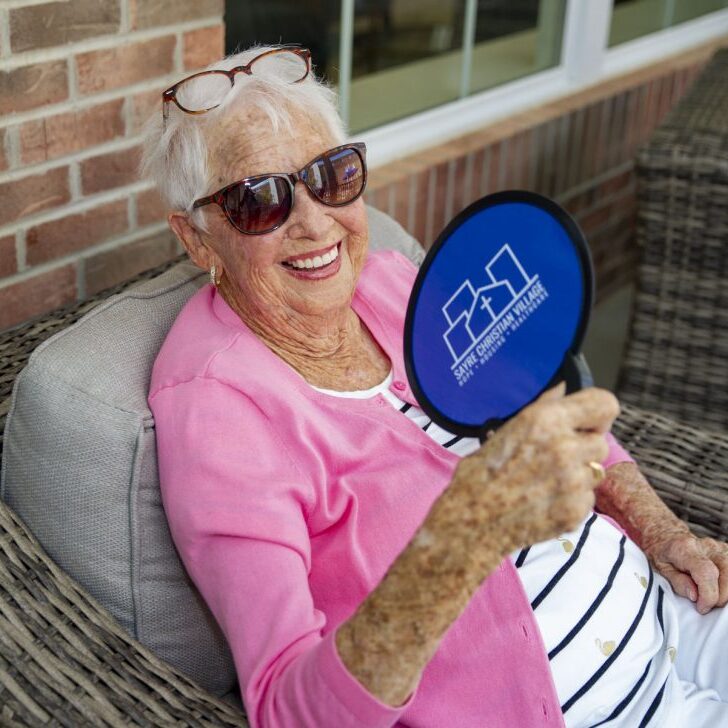 Independent Living, lady with a fan